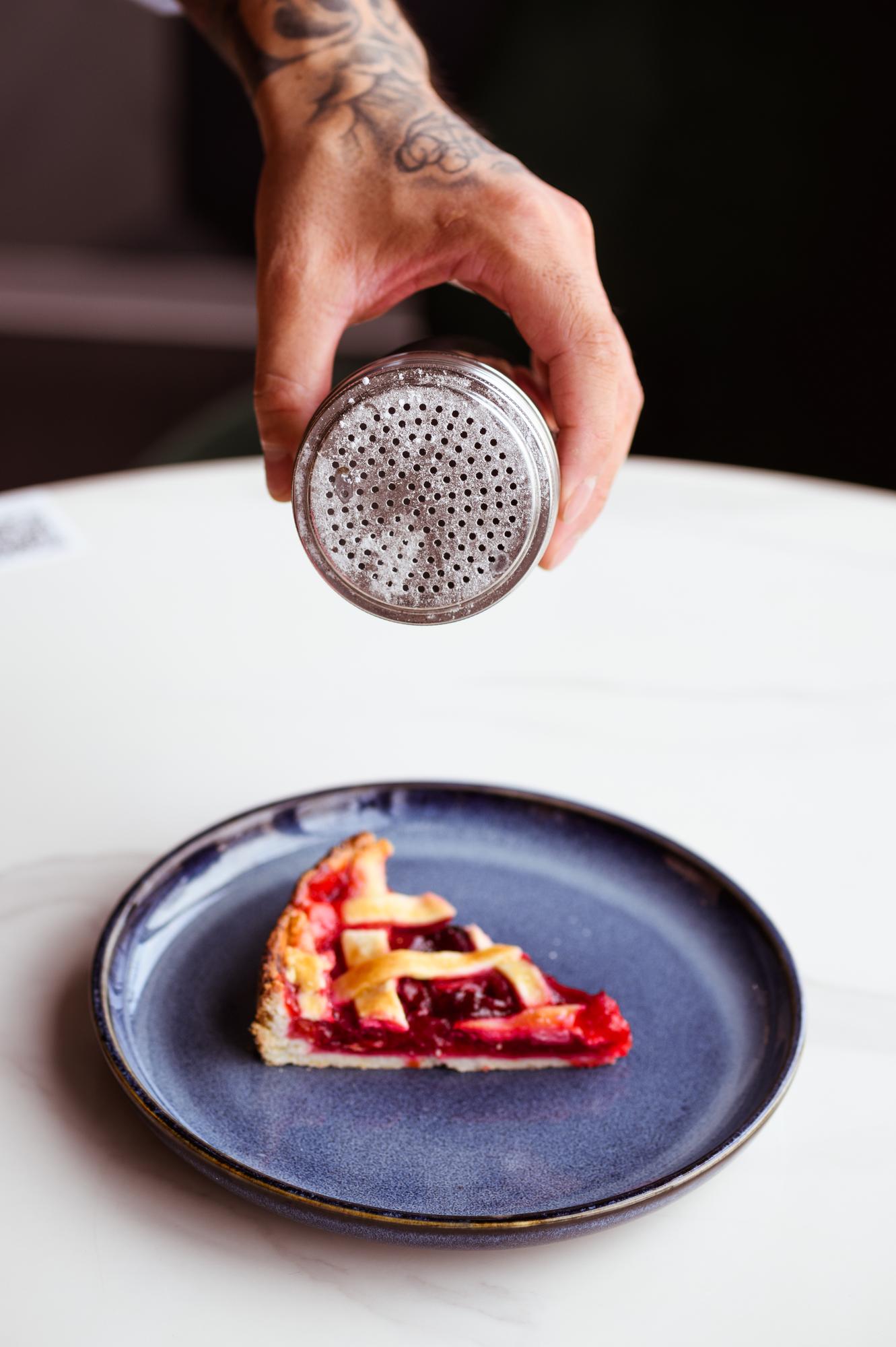 Chef plating a rustic dish